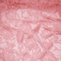 A swirled sample of Ada Stretch Lace in the color baby pink.