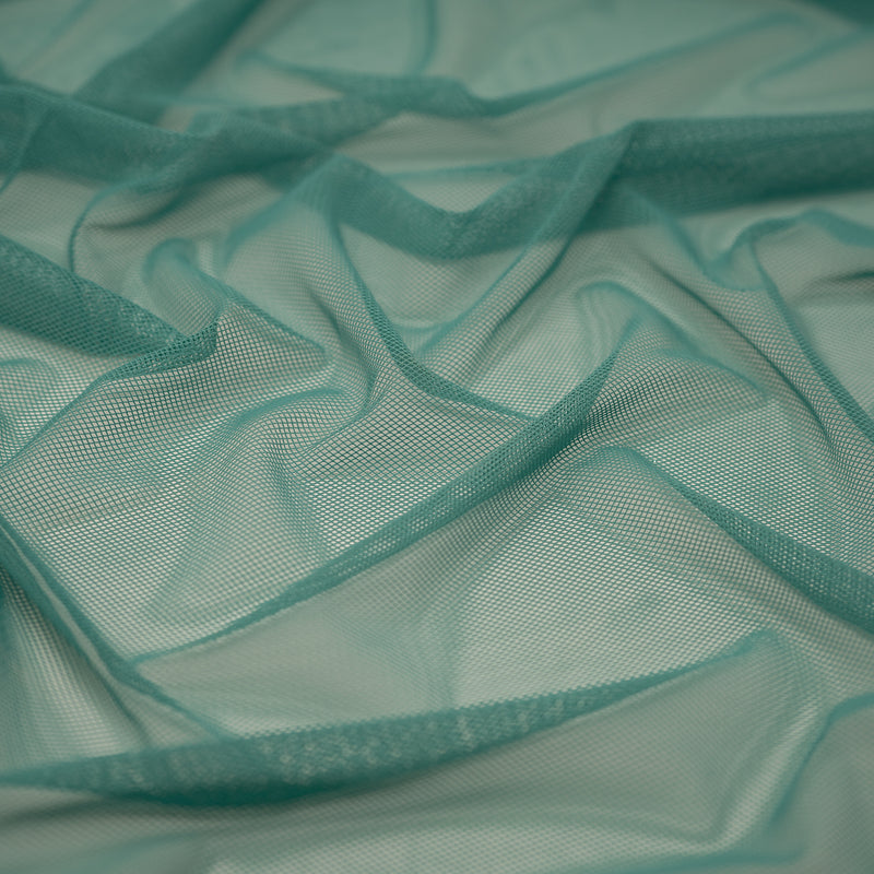 Detailed shot of Annette Stretch Mesh in color Jade.