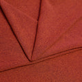 A folded piece of Blast Textured Spandex in Warm Pinecone