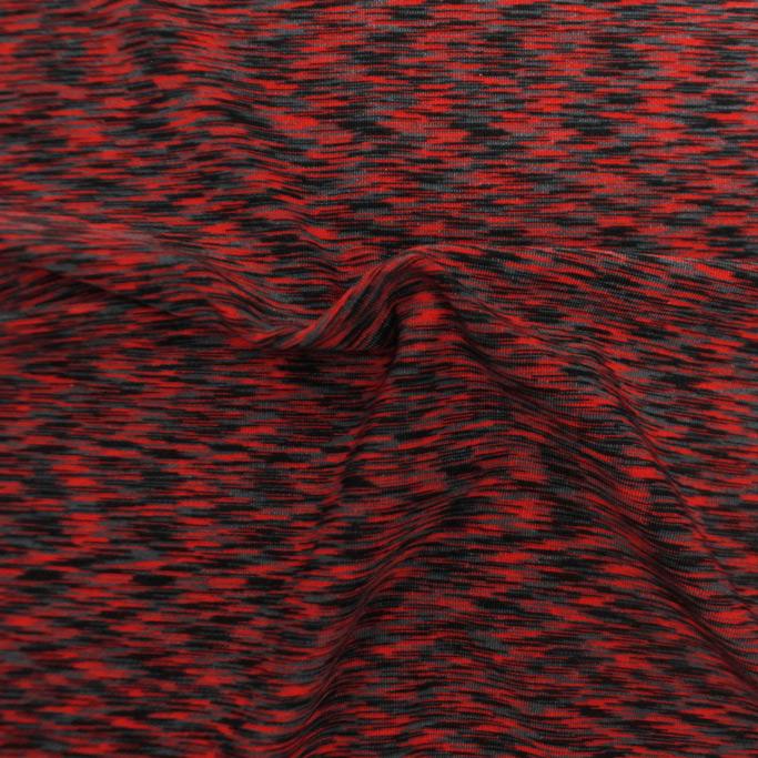 A swirled sample of blur space dye spandex in the color Blur Cherry.