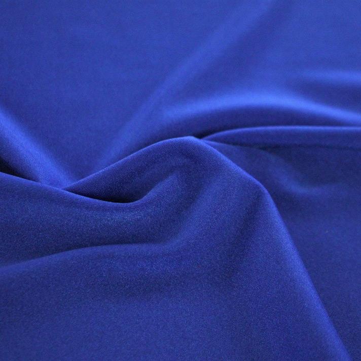 A swirled sample of Charisma shiny nylon spandex in the color royal.