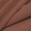 A folded piece of Cozy Polyester Spandex Terry Cloth in the color champagne.