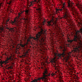 A draped sample of dancing snale glitter stretch mesh in the color black-red.