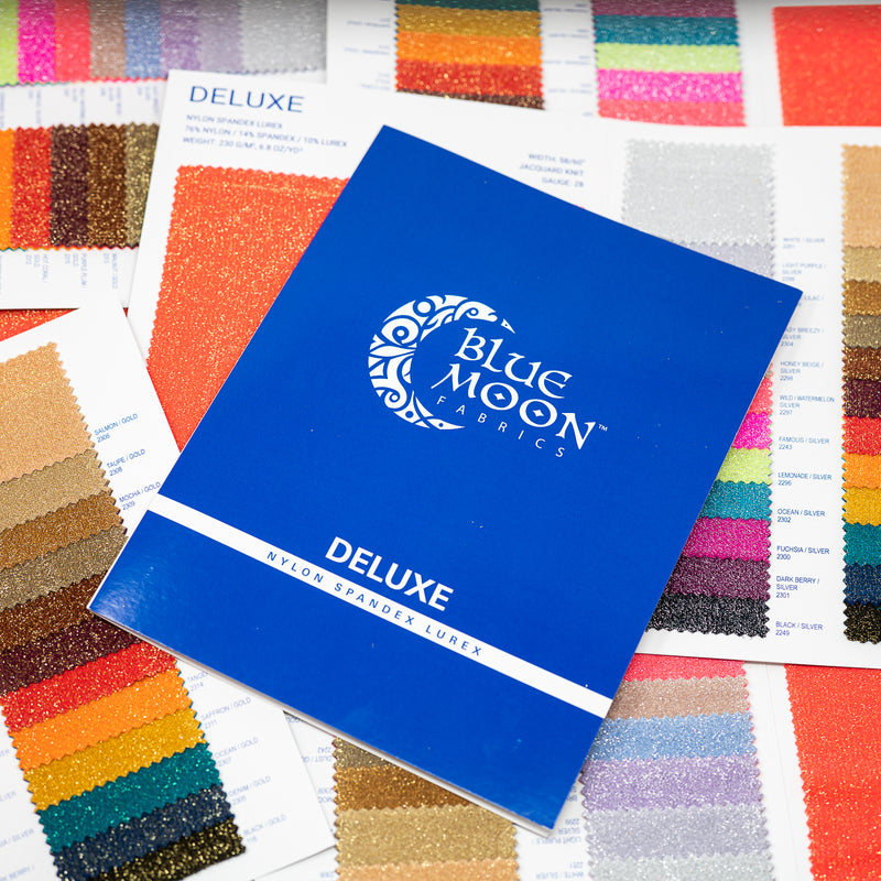 Cover shot of Deluxe Color Card Book laid over open Deluxe Color Card books.