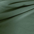 A draped sample of double ribbed spandex in the color pale cacti.