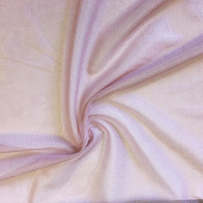 A swirled sample of foiled stretch mesh in the color mauve-gold.
