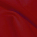 A flat sample of flexfilt recycled polyester spandex in the color paprika red.