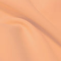 A flat sample of flexfilt recycled polyester spandex in the color rosy nude.