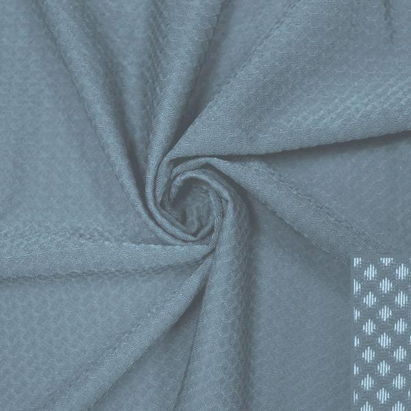 A swirled piece of Hive Textured Spandex in the color mist.