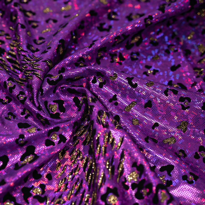 Swirled piece of Jag City Shattered Glass Foiled Spandex Fabric in the color Purple