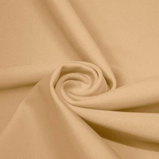 A swirled piece of matte nylon spandex fabric in the color almond.