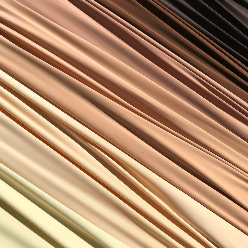 A flat sample of matte nylon spandex in  nude colors available at blue moon fabrics.