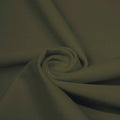 A swirled piece of matte nylon spandex fabric in the color sepia.