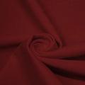 A swirled peice of microfiber nylon spandex in the color mars.