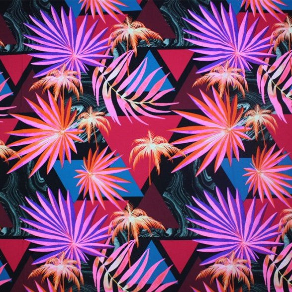 A flat sample of abstract palms printed spandex.