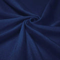A swirled piece of shiny nylon spandex in the color denim.