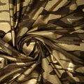 A swirled sample of Nugi Foil Printed Spandex in Dark Brown/Gold.