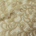 A falt sample of olivia stretch lace in the color nude.