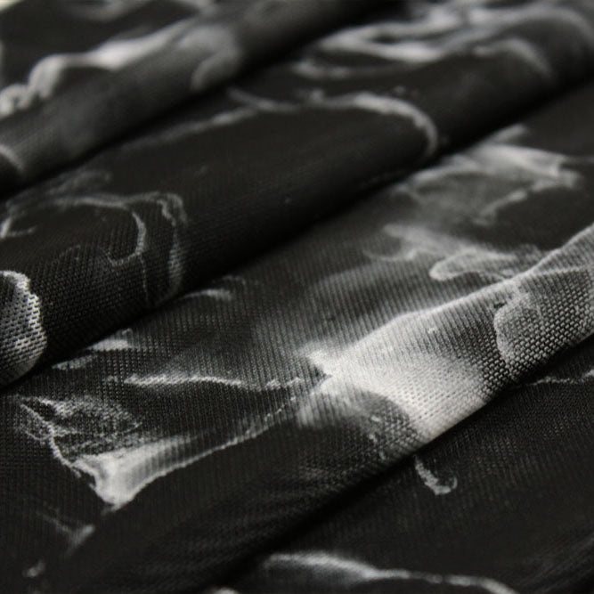 A folded sample of black marble printed power mesh.