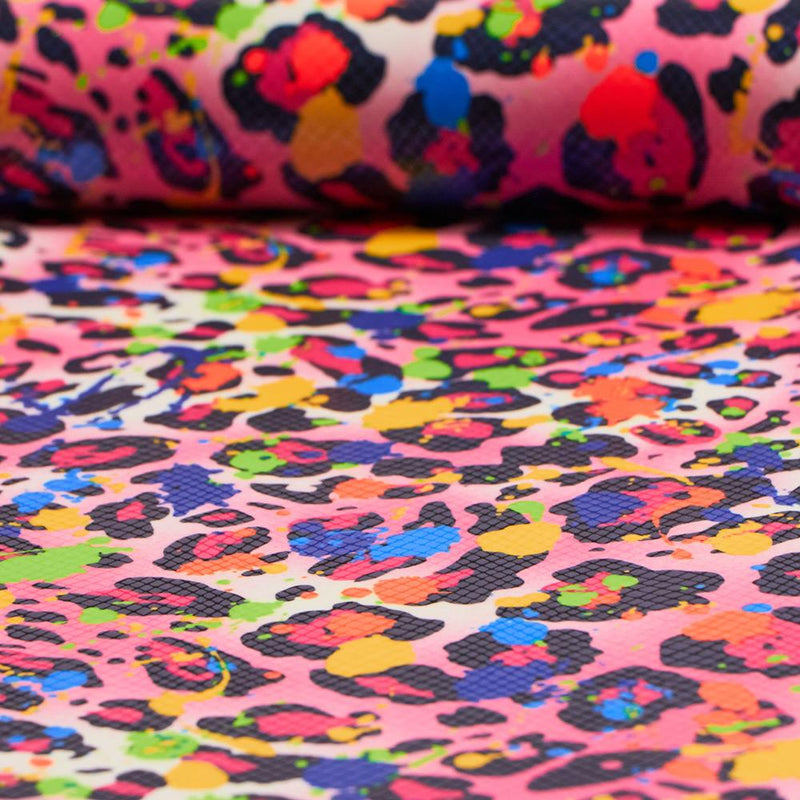 A folded sample of party animal foill printed spandex in the color pink.