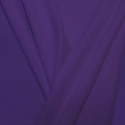 A pleated piece of performance nylon spandex fabric in the color morada.