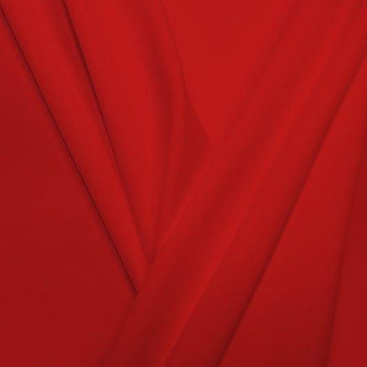 A pleated piece of performance nylon spandex fabric in the color red.