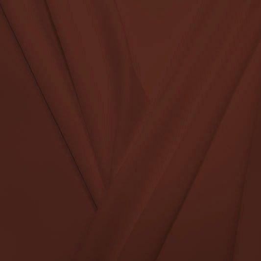 A pleated piece of performance nylon spandex fabric in the color warm pinecone.