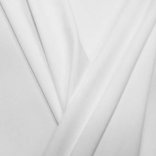 A pleated piece of performance nylon spandex fabric in the color white.