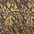 A flat sample of pollock shttered glass foiled spandex in the color gold.