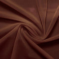 A swirled piece of nylon spandex power mesh in the color brown.