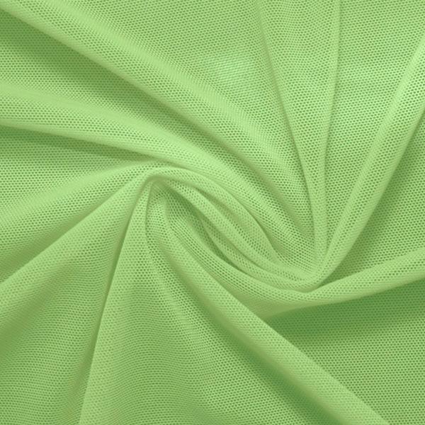 A swirled piece of nylon spandex power mesh in the color lucky charm.