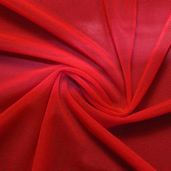 A swirled piece of nylon spandex power mesh in the color red.