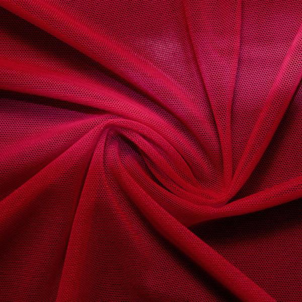 A swirled piece of nylon spandex power mesh in the color scarlet.