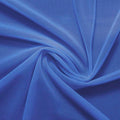 A swirled piece of nylon spandex power mesh in the color sedona blue.