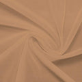 A swirled piece of nylon spandex power mesh in the color sun beige.