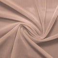 A swirled piece of nylon spandex power mesh in the color taupe.