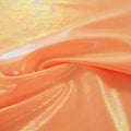 A swirled sample of popcorn polyester spandex jacquard in the color tangerine orange.