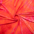A swirled sample of renegade tie-dyed stretch velvet in Hot Pink.