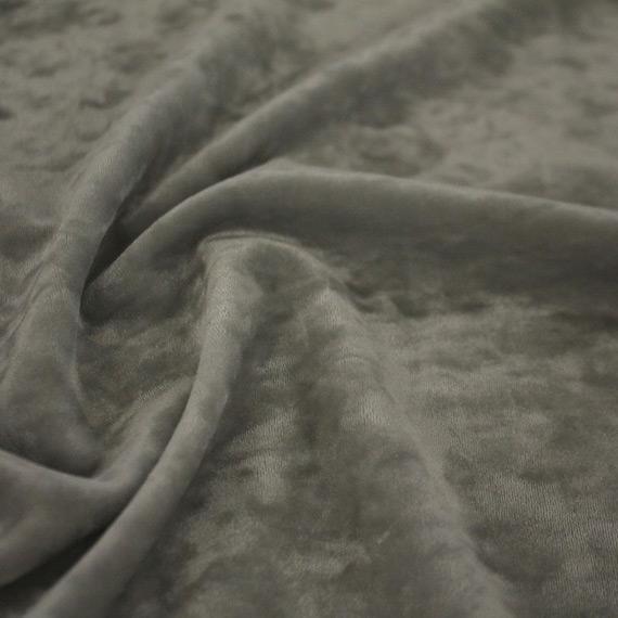 A swirled sample of revival crushed stretch velvet in the color silver.