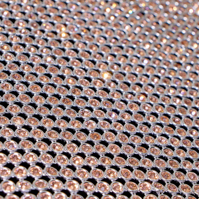 A flat sample of rhinestone aluminum scale mesh in the color gold.