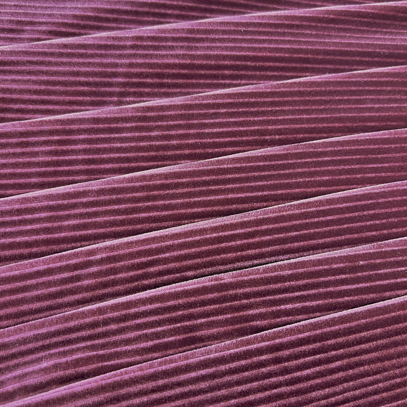 A flat sample of Ribbed Velvet Spandex Fabric in the color fig
