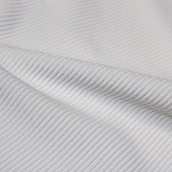 A rippled piece of Ribbed Spandex in the color white.