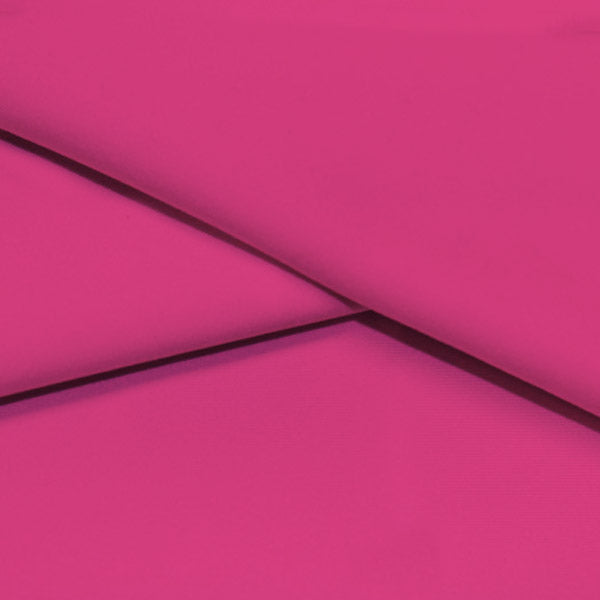 A folded piece of Ripple Recycled Polyester Spandex in the color bright pink.