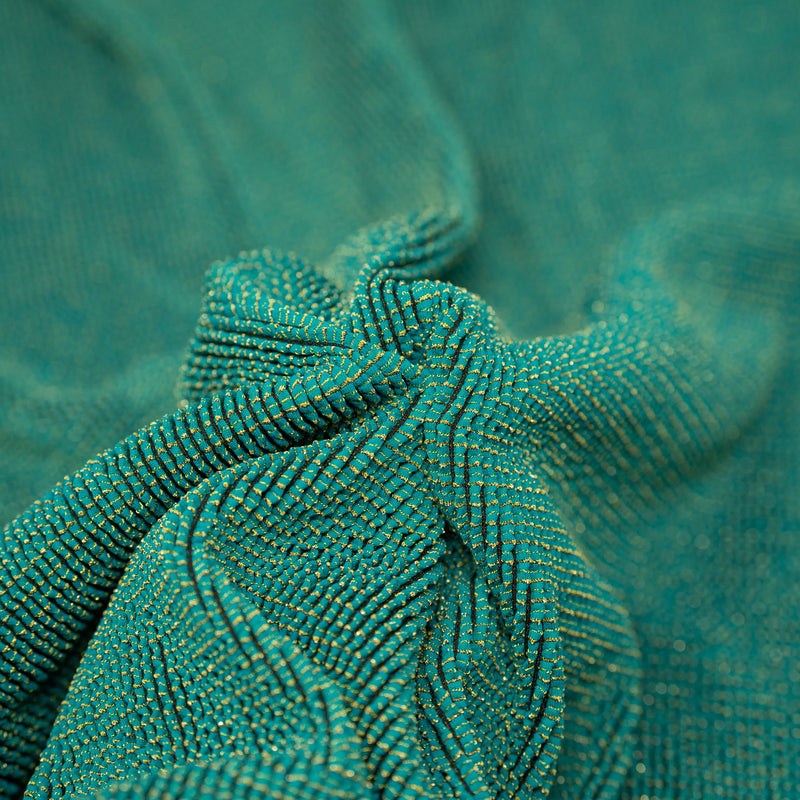 Detailed interior shot of Ritzy Crinkle Nylon Polyester Spandex with Metallic in the color Ocean