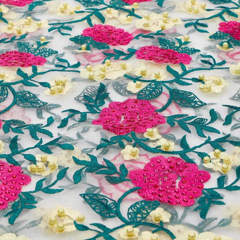 A flat sample of rose and vine embroiered mesh in the colors yellow-pink-white.