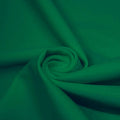 A swirled piece of microfiber nylon spandex in the color Cool Green