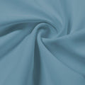 A swirled piece of Synergy Polyester Lycra in the color mint.