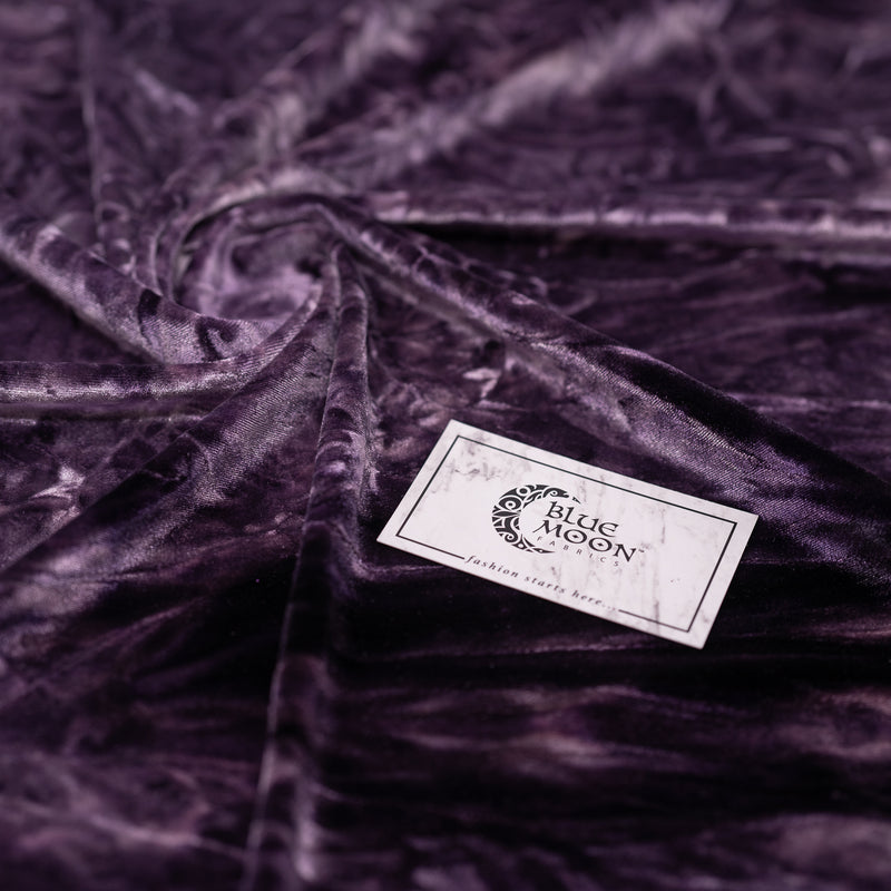 A piece of Tempest Tie Dye on Revival Crushed Stretch Velvet Fabric in color Eggplant.
