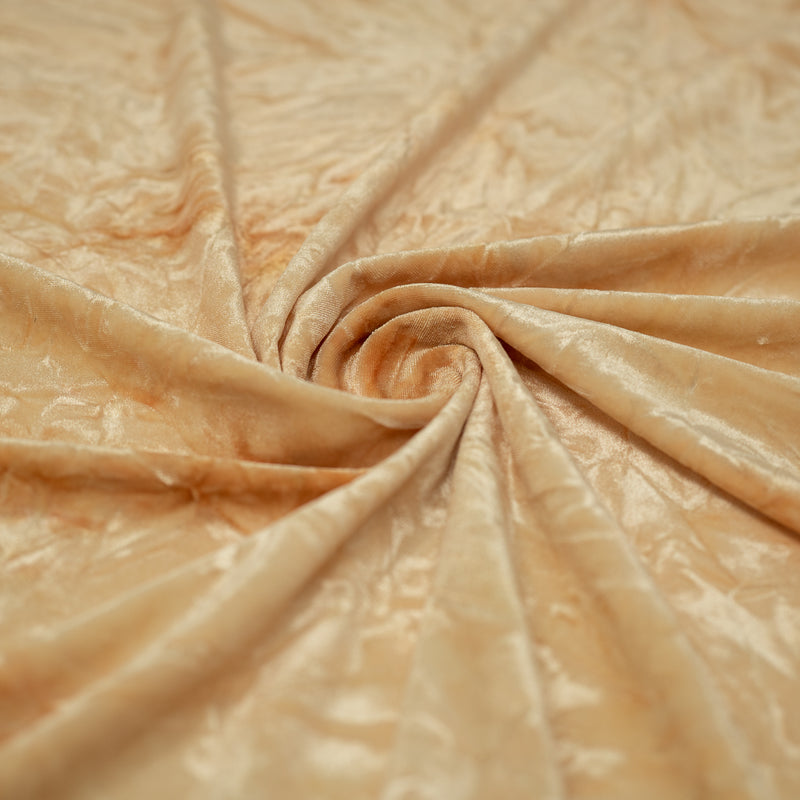 A piece of Tempest Tie Dye on Revival Crushed Stretch Velvet Fabric in color Sand.