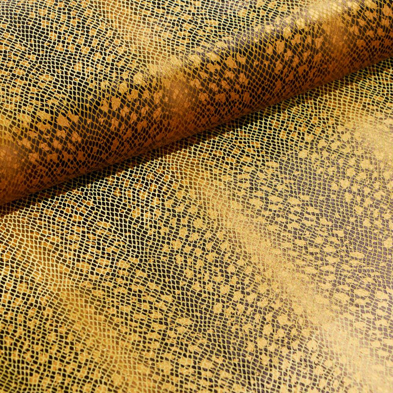 A folded sample of venomour foil printed stretch velvet in the color gold available at blue moon fabrics.